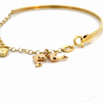 Pulsera en oro con dijes colgantes