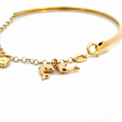 Pulsera en oro con dijes colgantes