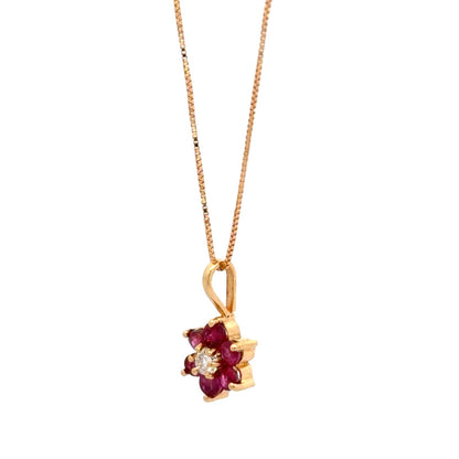 Dije flor en rubíes y diamante