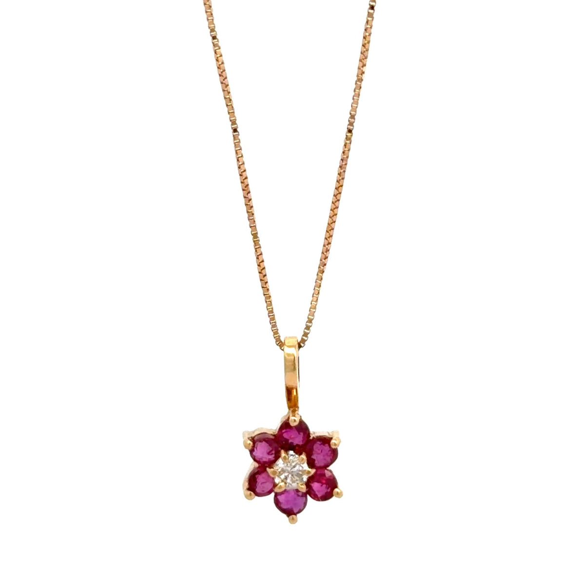 Dije flor en rubíes y diamante